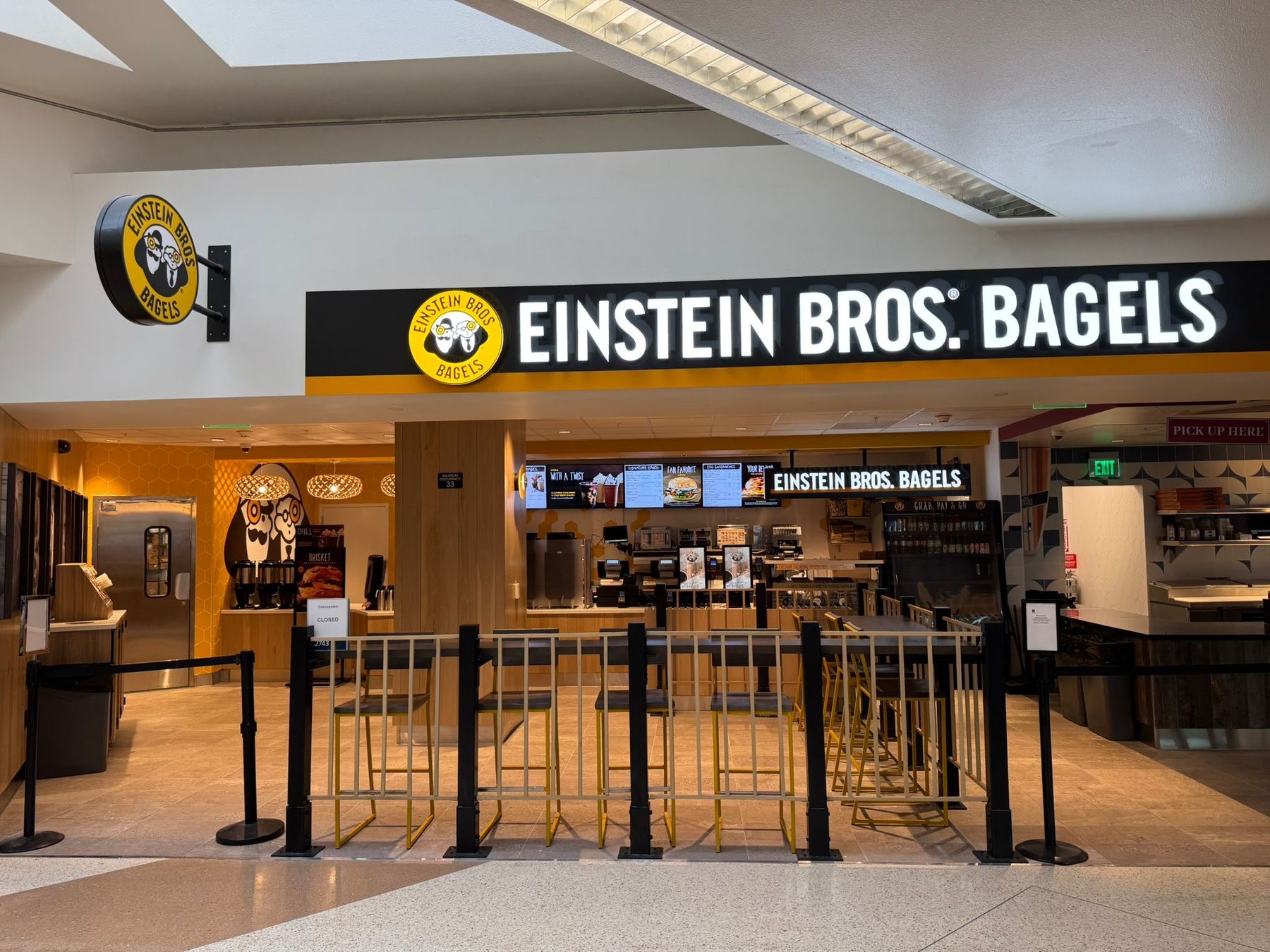 Einstein Bros Bagels storefront and queuing area at San José Mineta International Airport